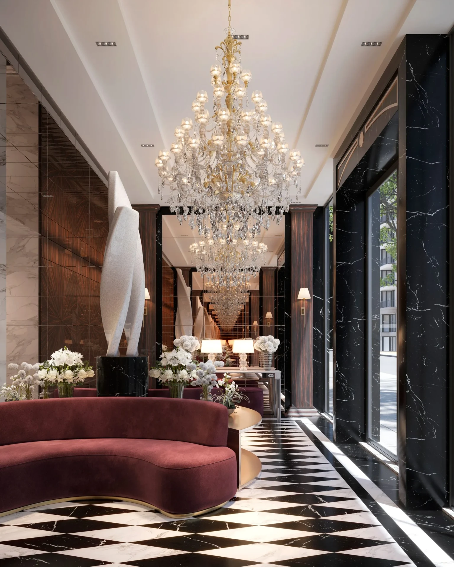 Grand marble lobby with chandelier and considered styling.